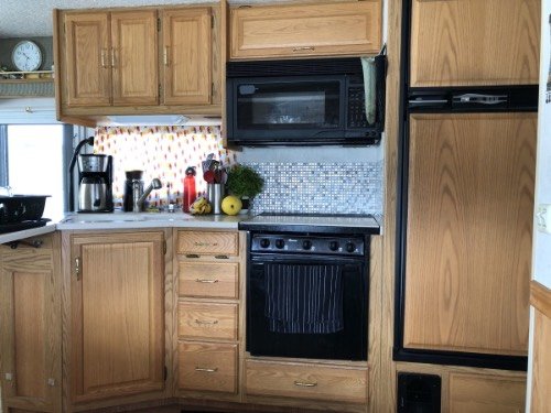 a view of the kitchen in a class a motorhome.