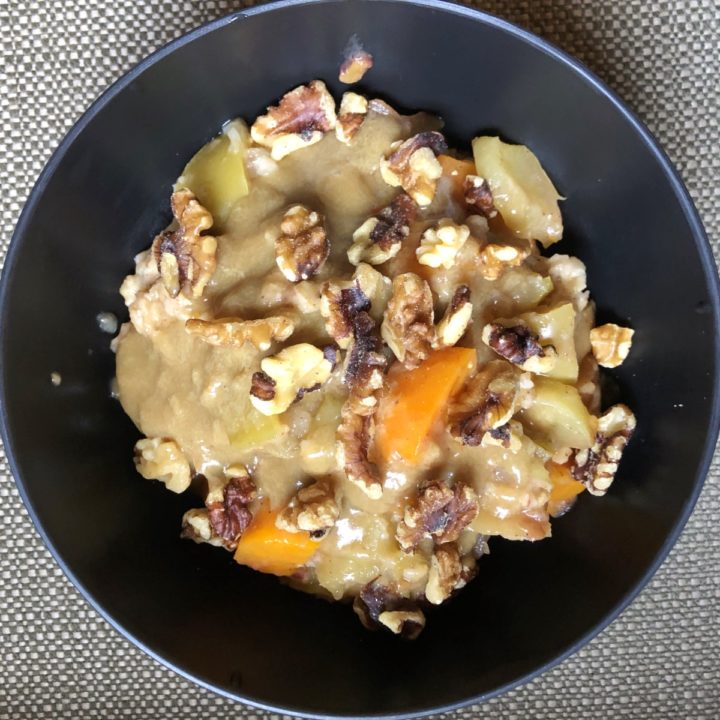instant pot sweet potato apple and oats recipe in a black bowl.
