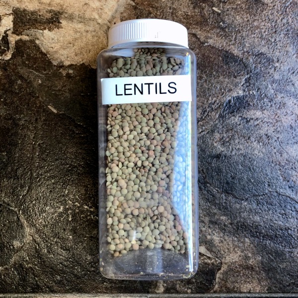 a plastic container full of lentils.