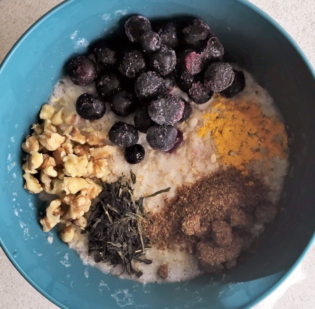 oatmeal with blueberries, walnuts, flaxseed, green tea, and turmeric.