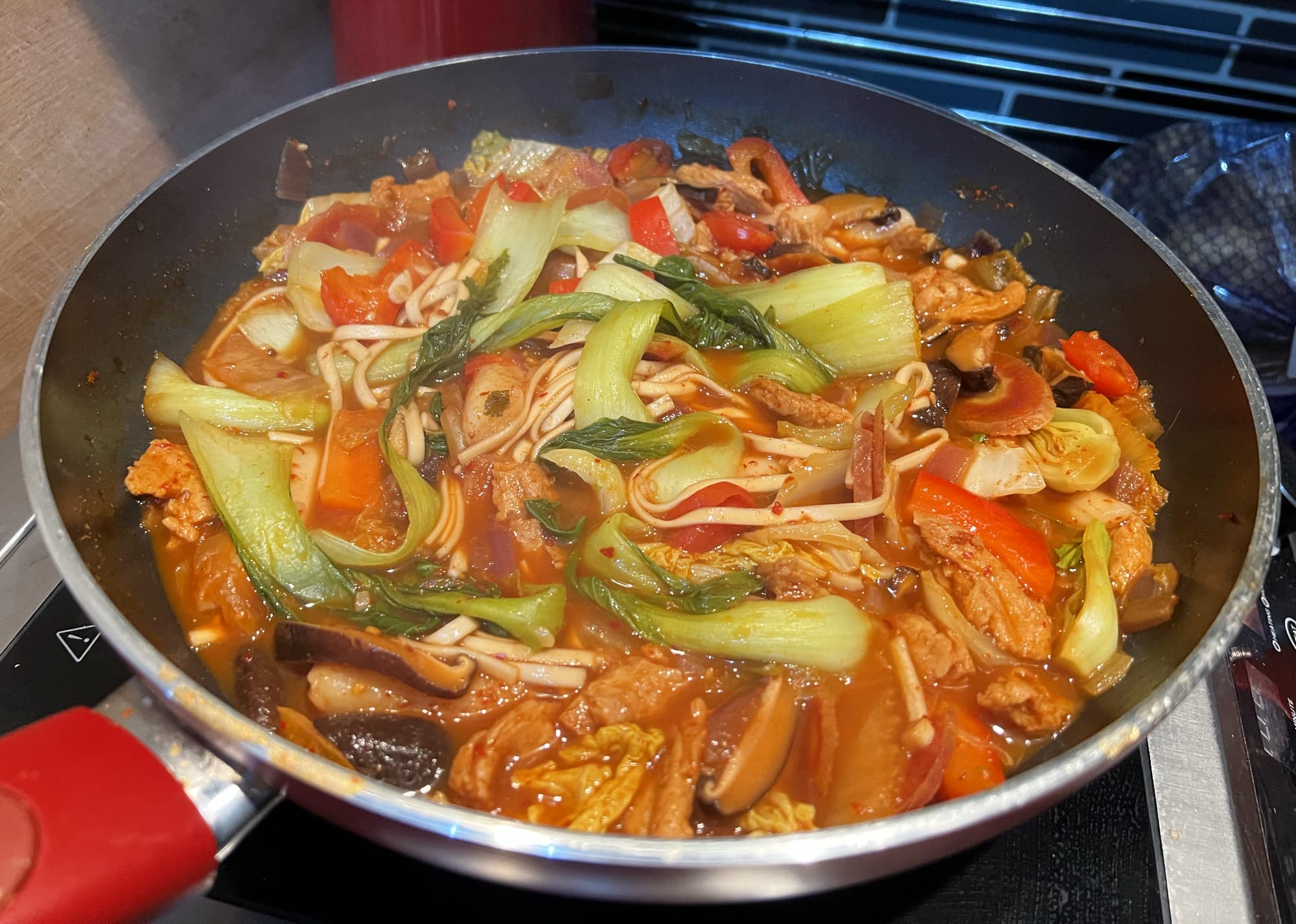korean style stew cooking on a hot plate.